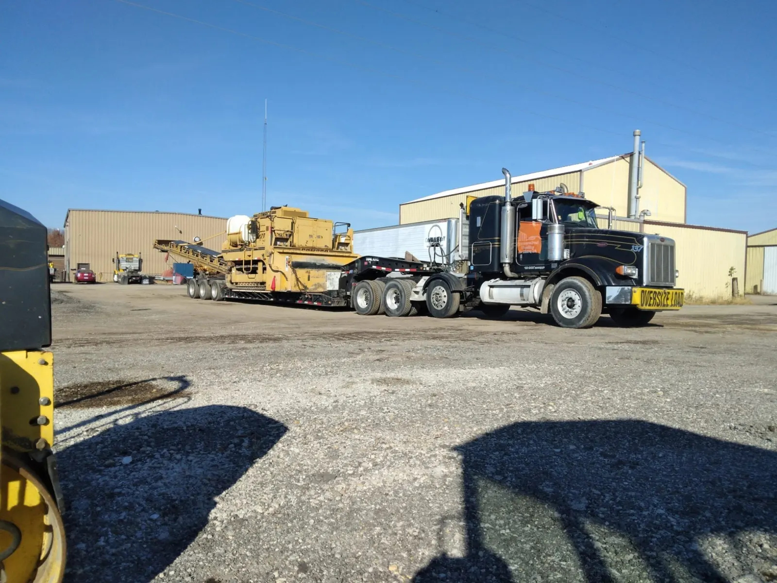 Lowboy hauling a paver